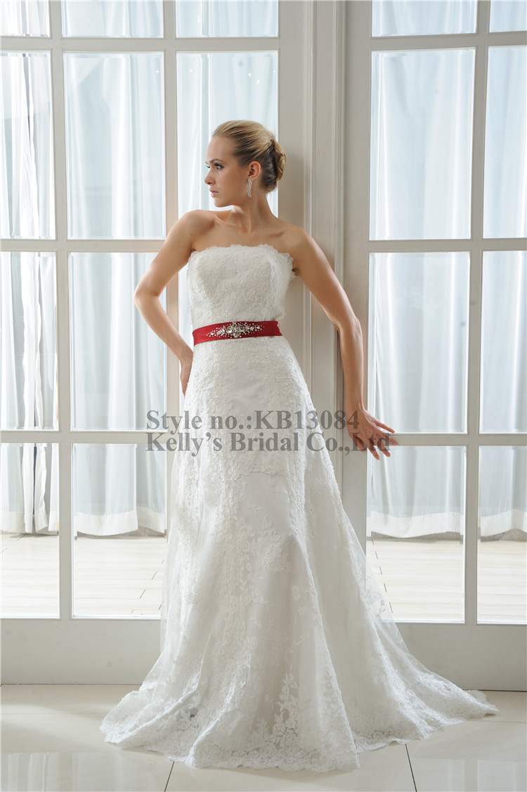 wedding dress with large red ribbon