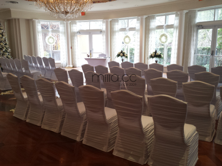 white ruffled ruched chair covers.png