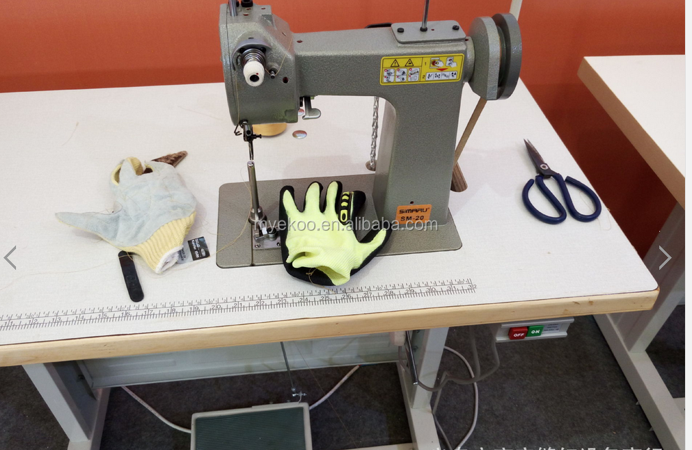 Green color reinforced palm leather gloves sewing machine.png