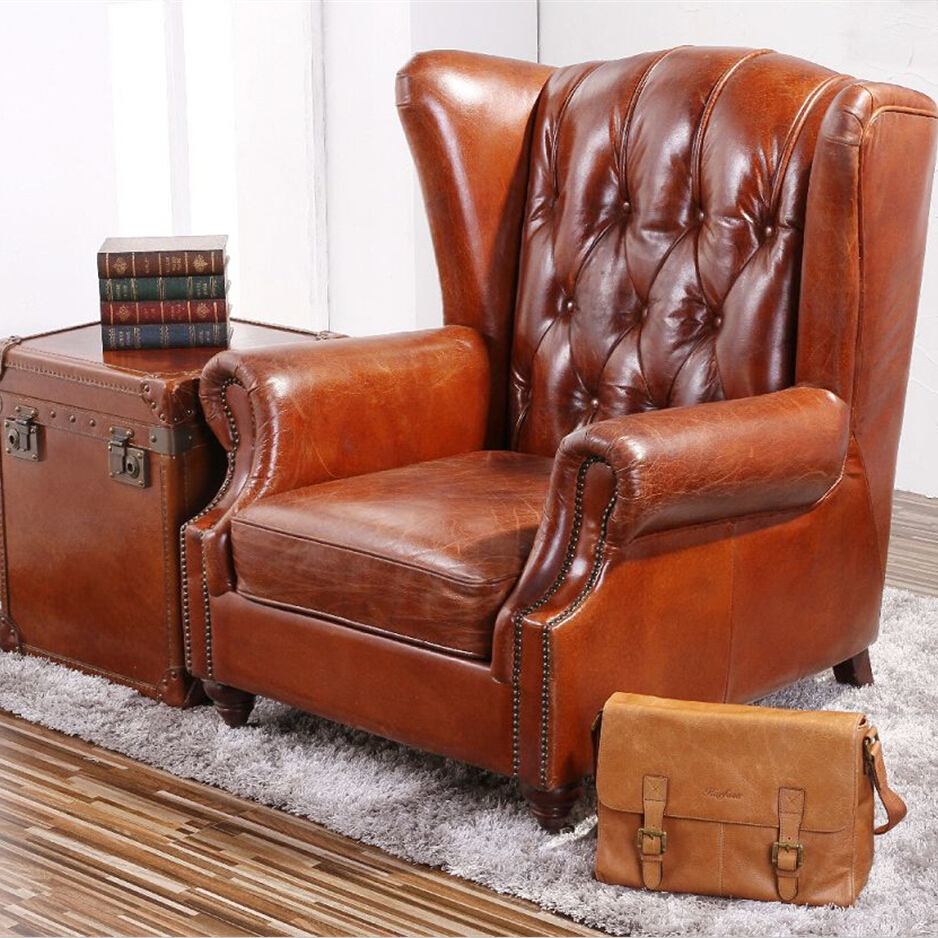 antique vintage leather wing chair.jpg